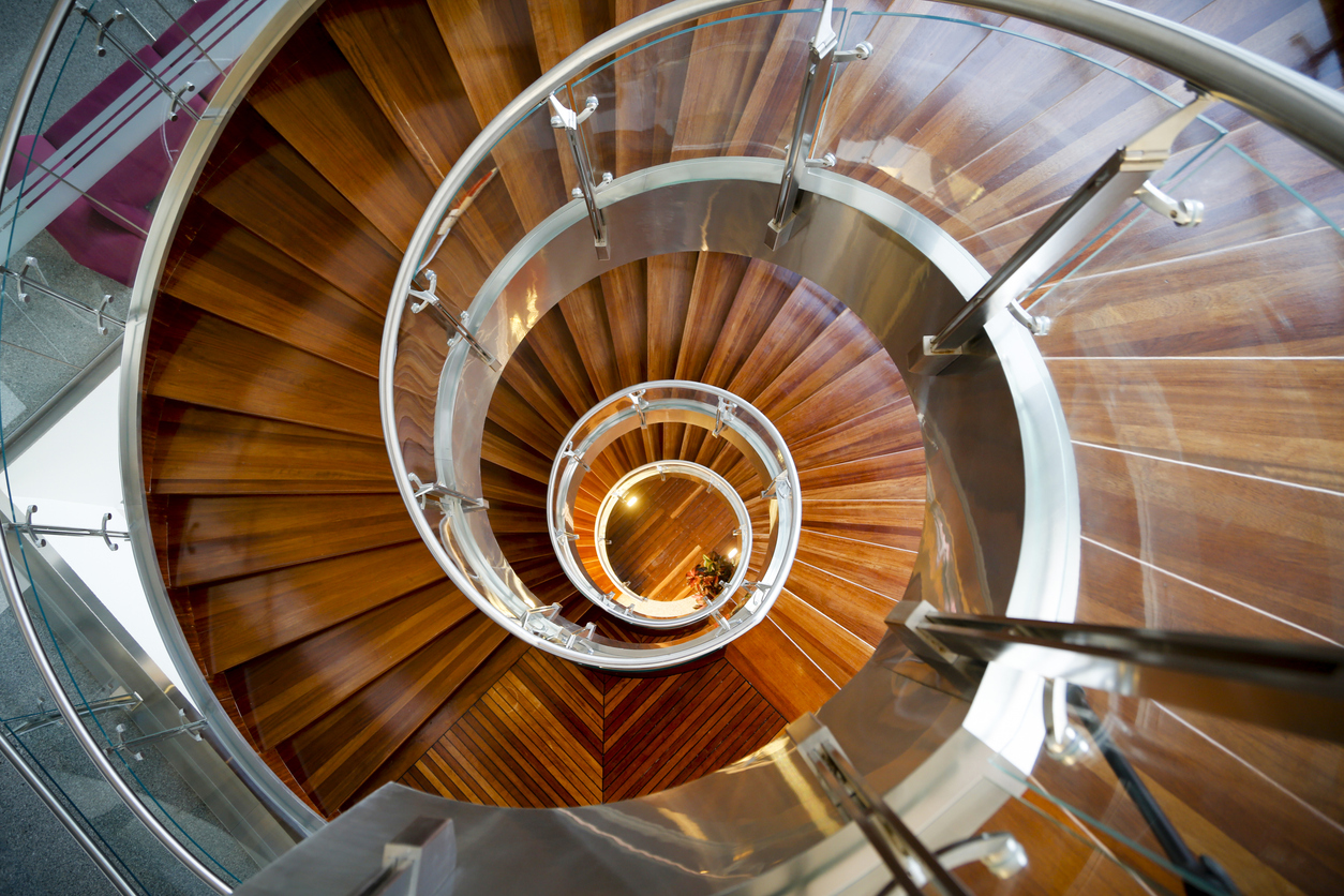 a stunning spiral aluminium staircase leading down into a metaphorical rabbit hole - is the EU creating too many protectionist measures? might it damage the European steel industry instead of safeguarding it?